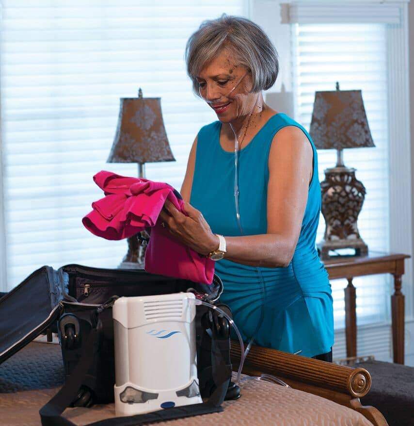 Woman packing bags with the Caire Freestyle Comfort